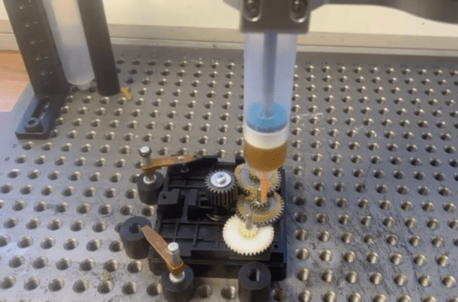 UR cobot fitted with Aim Robotics fluid dispenser.